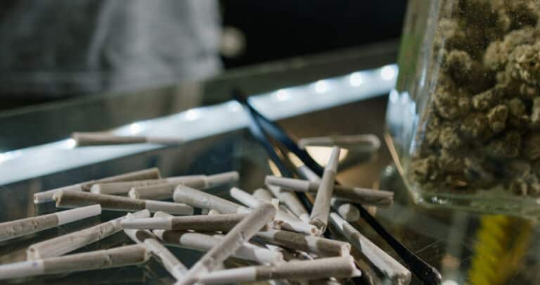 A budtender works inside of a retail cannabis shop in Oregon.